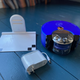 Base de carga, enchufe y robot